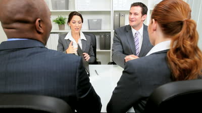 stock-footage-young-business-people-presenting-business-plan-to-banking-executives-for-consideration